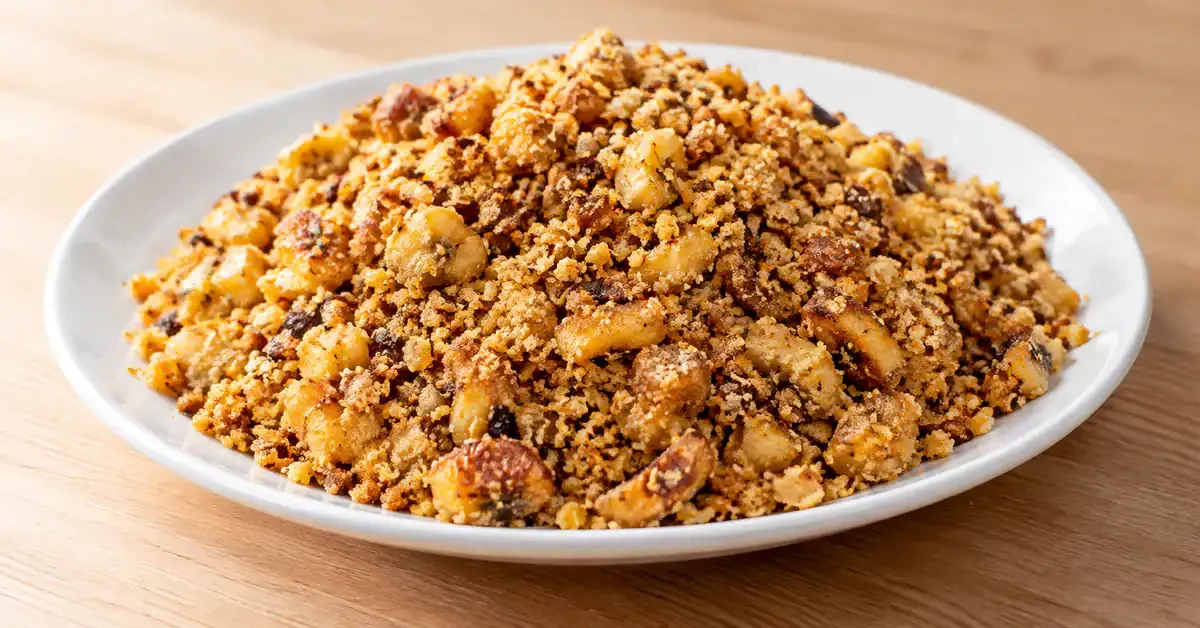 Brazilian plantain farofa served on a white plate