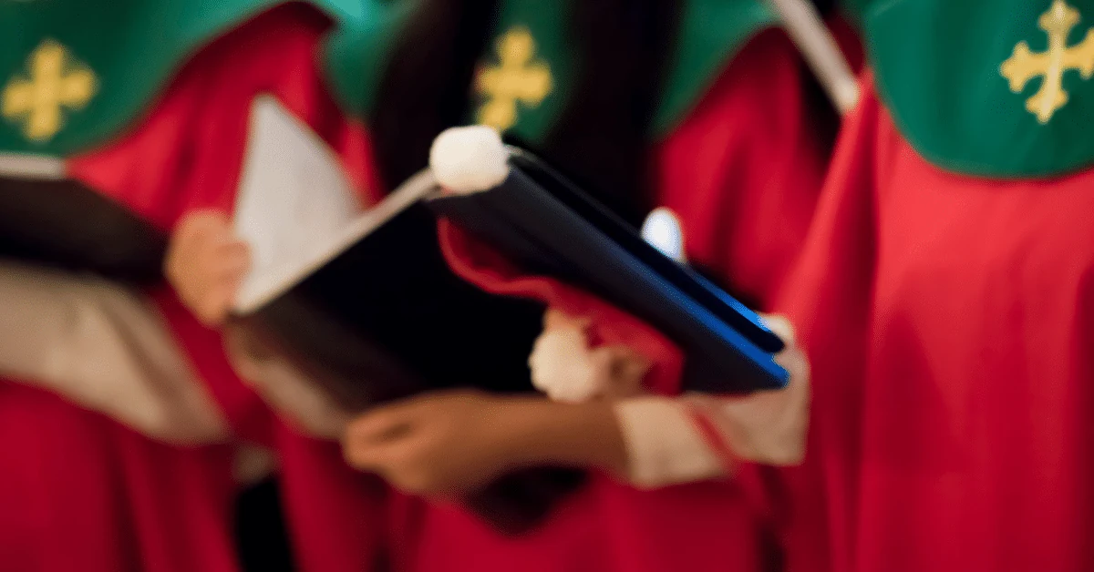 Carol singers holding music folders
